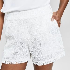Floral lace adorns these shorts from INC International Concepts®